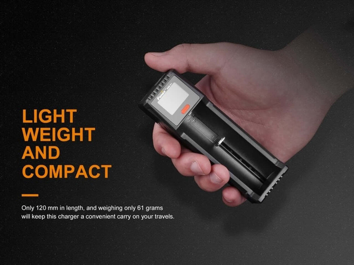 Fenix ARE-D1 Smart Battery Charger held in a hand, showcasing its lightweight and compact design for travel.