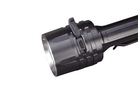 Close-up of Fenix LR35R rechargeable flashlight showing USB Type-C charging port and robust design.