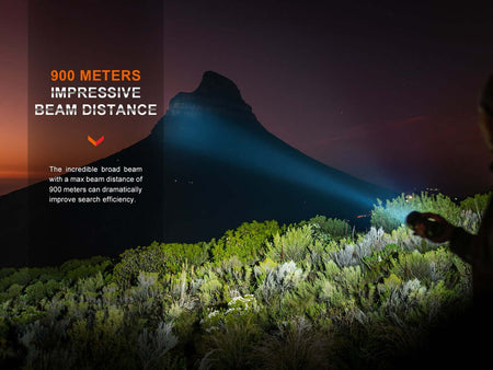 Bright beam from Fenix LR40Rv2 flashlight illuminating a landscape, showcasing 900 meters beam distance for search efficiency.