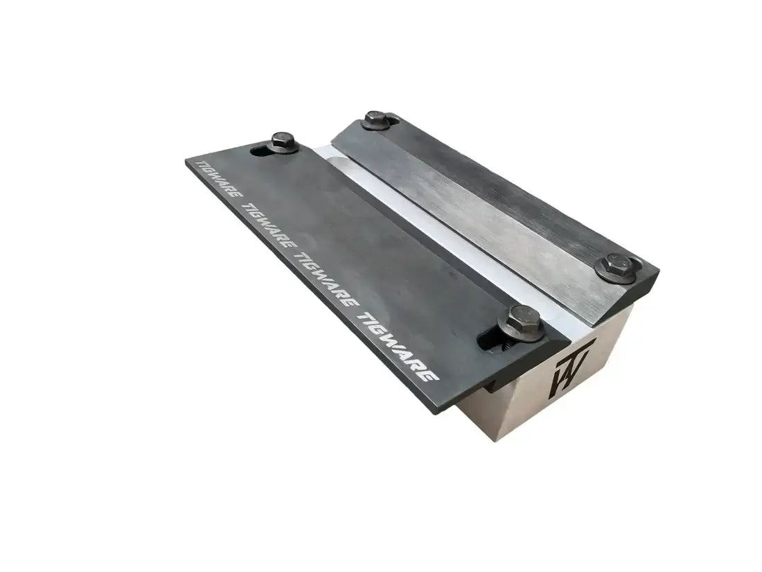 AERO Aerospace TIG welding test fixture with clamping plates and bolts for precision welding.
