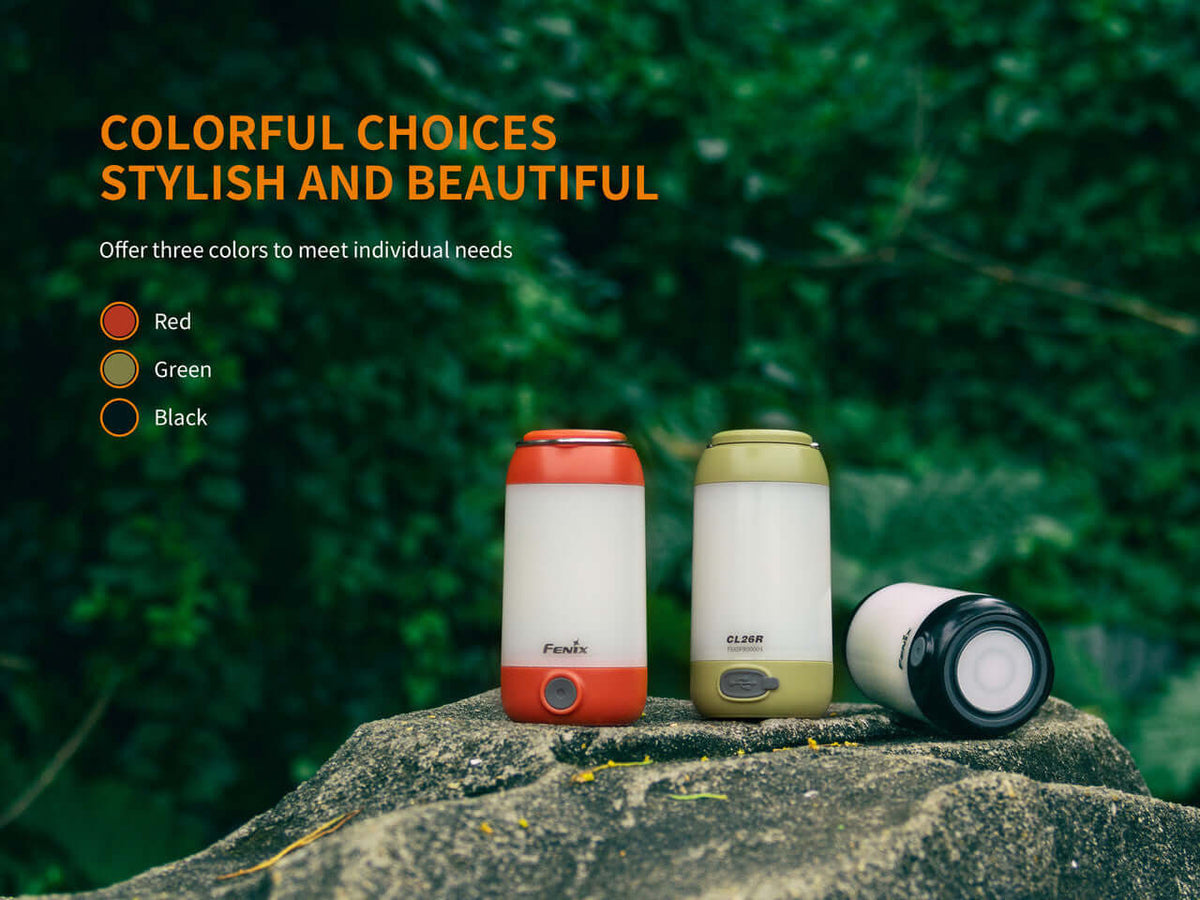 Fenix CL26R camping lanterns in red, green, and black showcased outdoors, highlighting stylish and practical color options.
