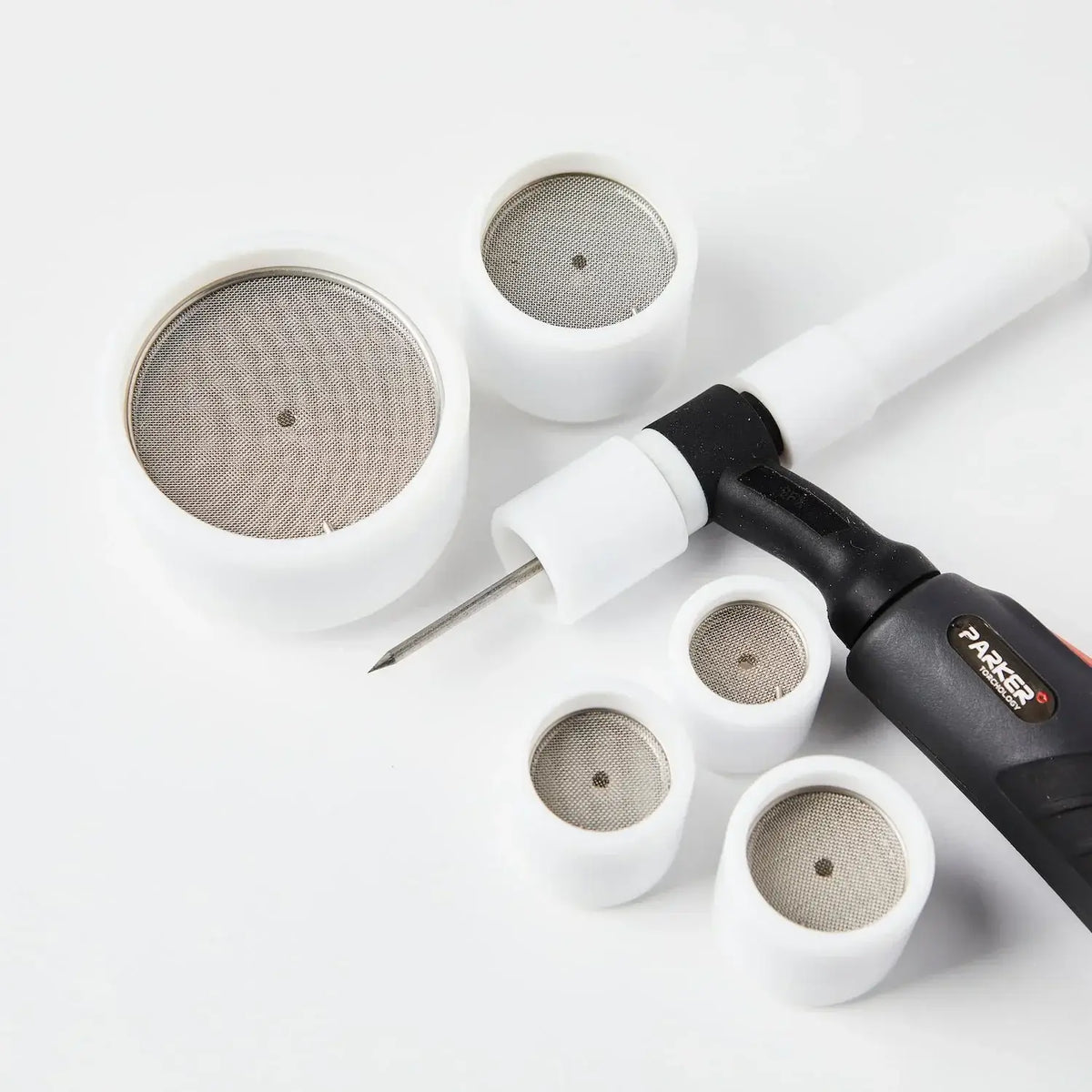 Teflon cups and welding tool, showcasing durable TEFLON construction and mesh design for superior gas flow in welding applications.