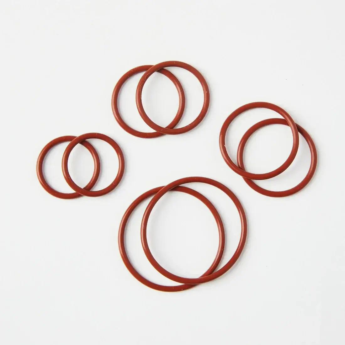 High temperature rated red silicone O-rings, ideal for TIG welding applications, showing multiple sizes arranged on a white background.