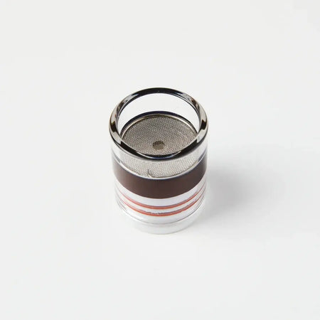 Close-up of a quartz cup/nozzle with a mesh filter, designed for smooth gas flow in TIG welding.