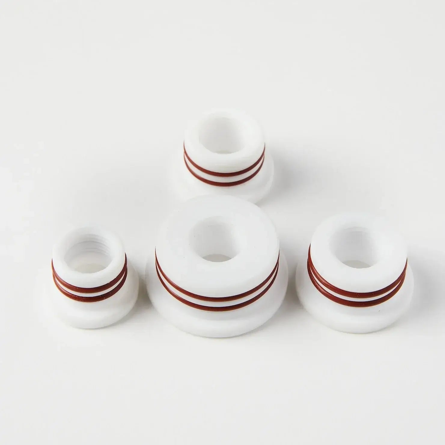Set of four Teflon Beaver Unit Adapter O-rings, designed for durability and resistance under normal use.