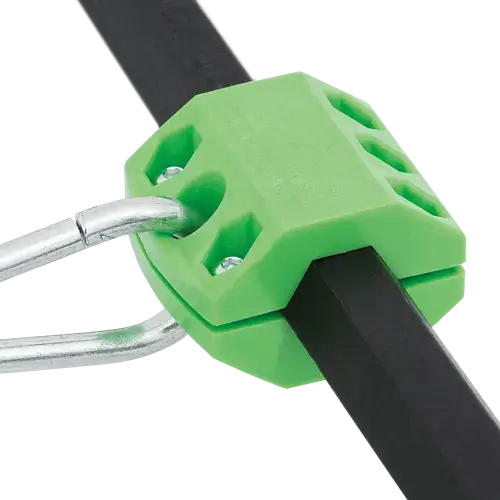 Green reusable clamp securely holding round and hex shank tool bodies, designed for safety and durability.